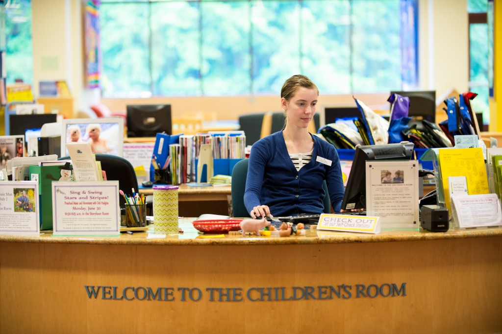 librarian at children's desk Wellesley Free Library